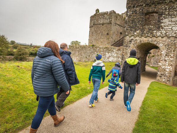 Family entering Carew Castle